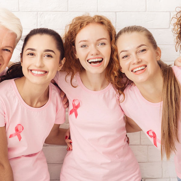 Breast Cancer Survivors wearing pink t-shirts
